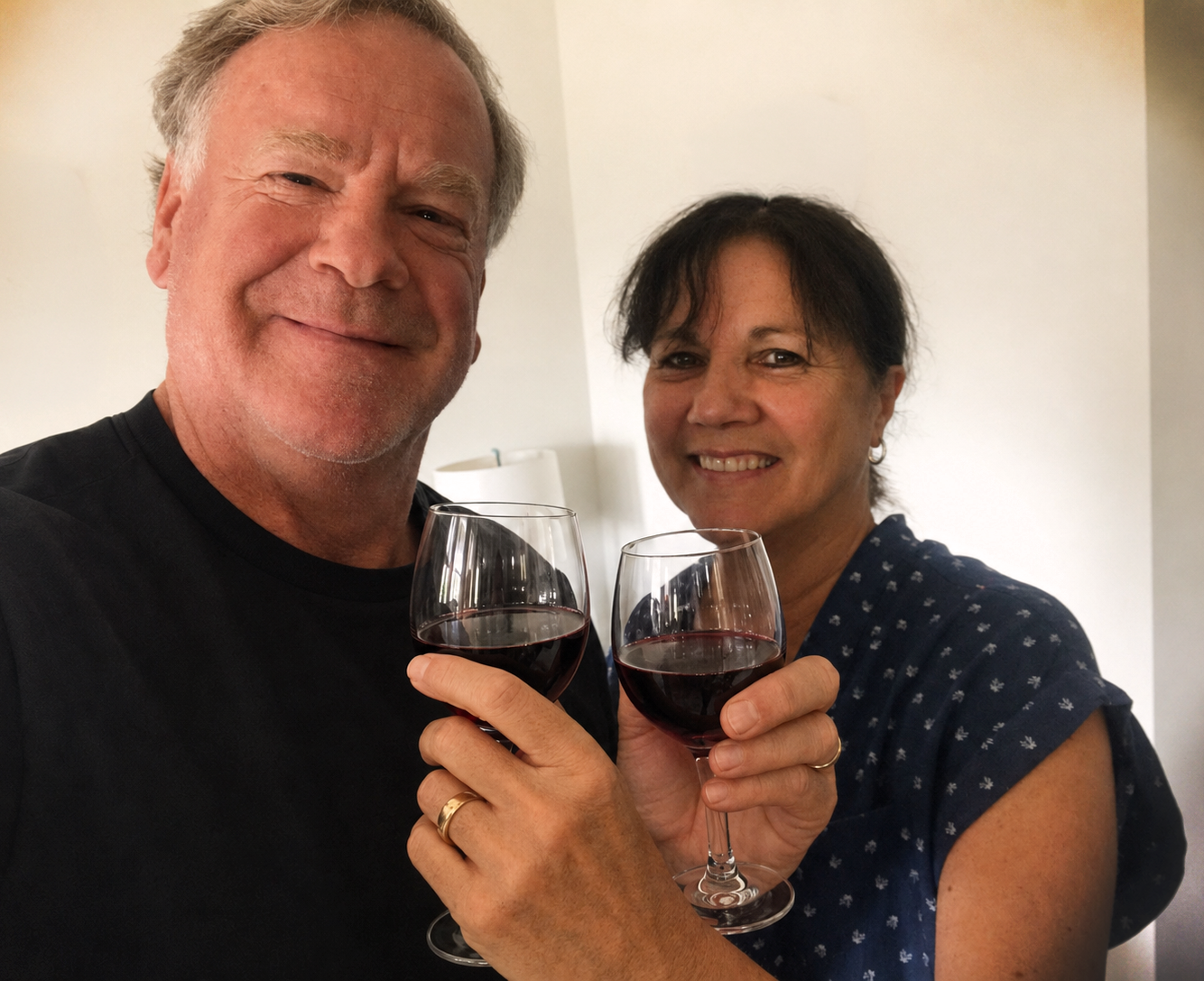 Blaine and Margee Boyer raising glasses of Reliant wine together