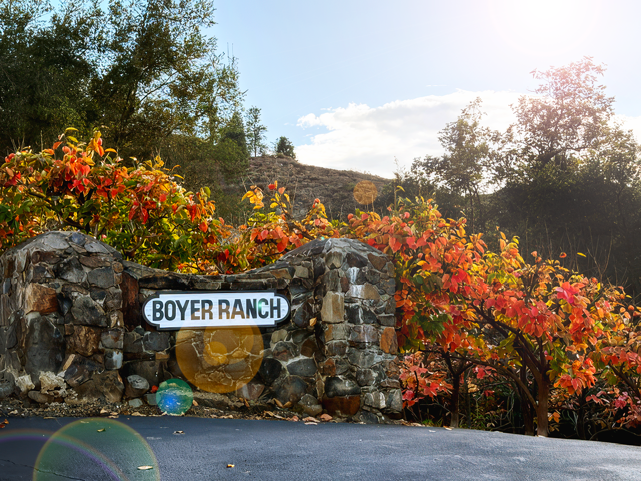 Boyer Ranch entrance sign surrounded by vibrant autumn foliage